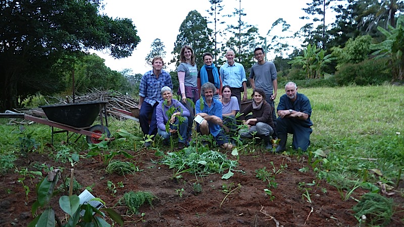 The class and Tom, posing behind a fruit tree we planted and surrounded with about 30 "support" species.